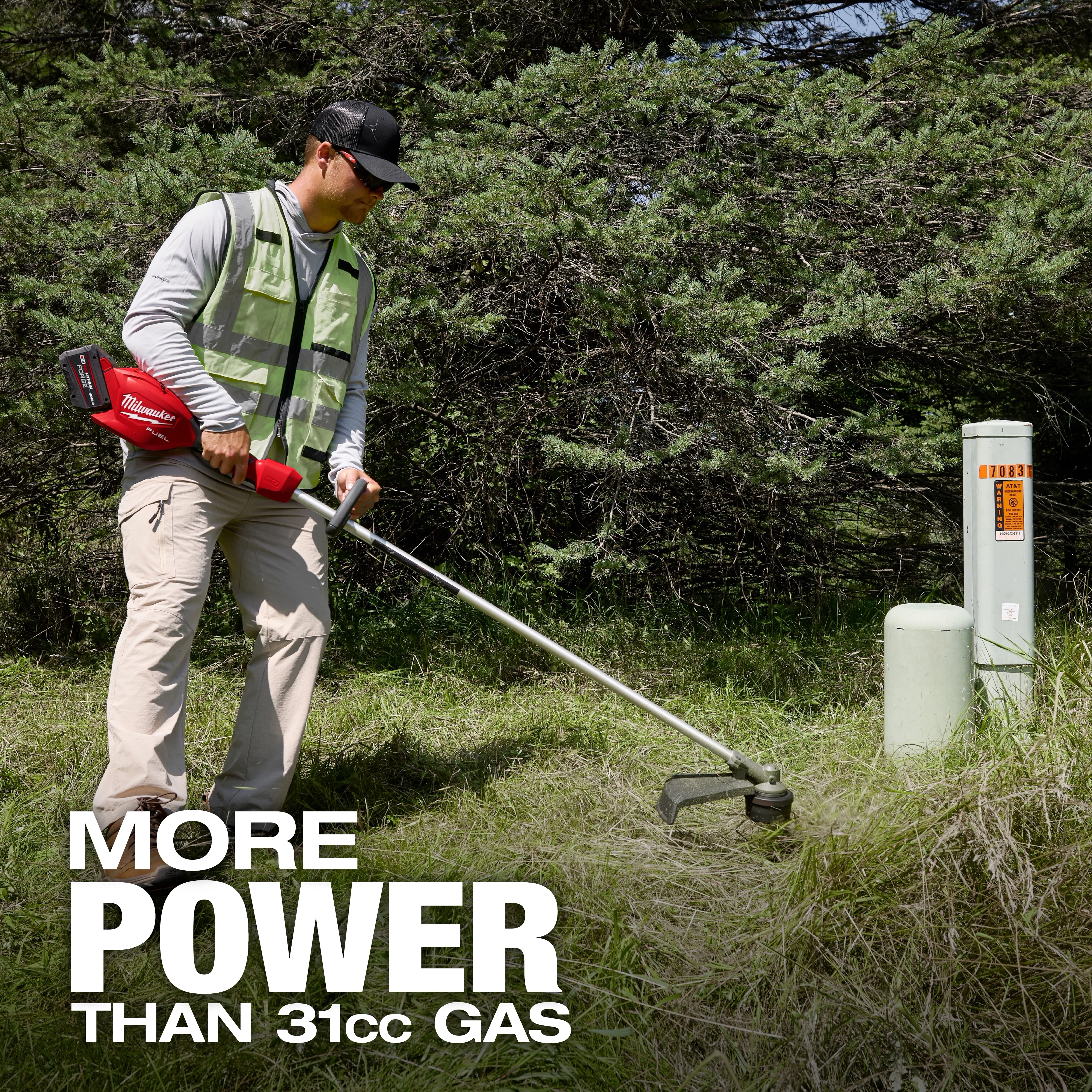 Person using a red cordless trimmer on grass near trees, with text "MORE POWER THAN 31cc GAS."