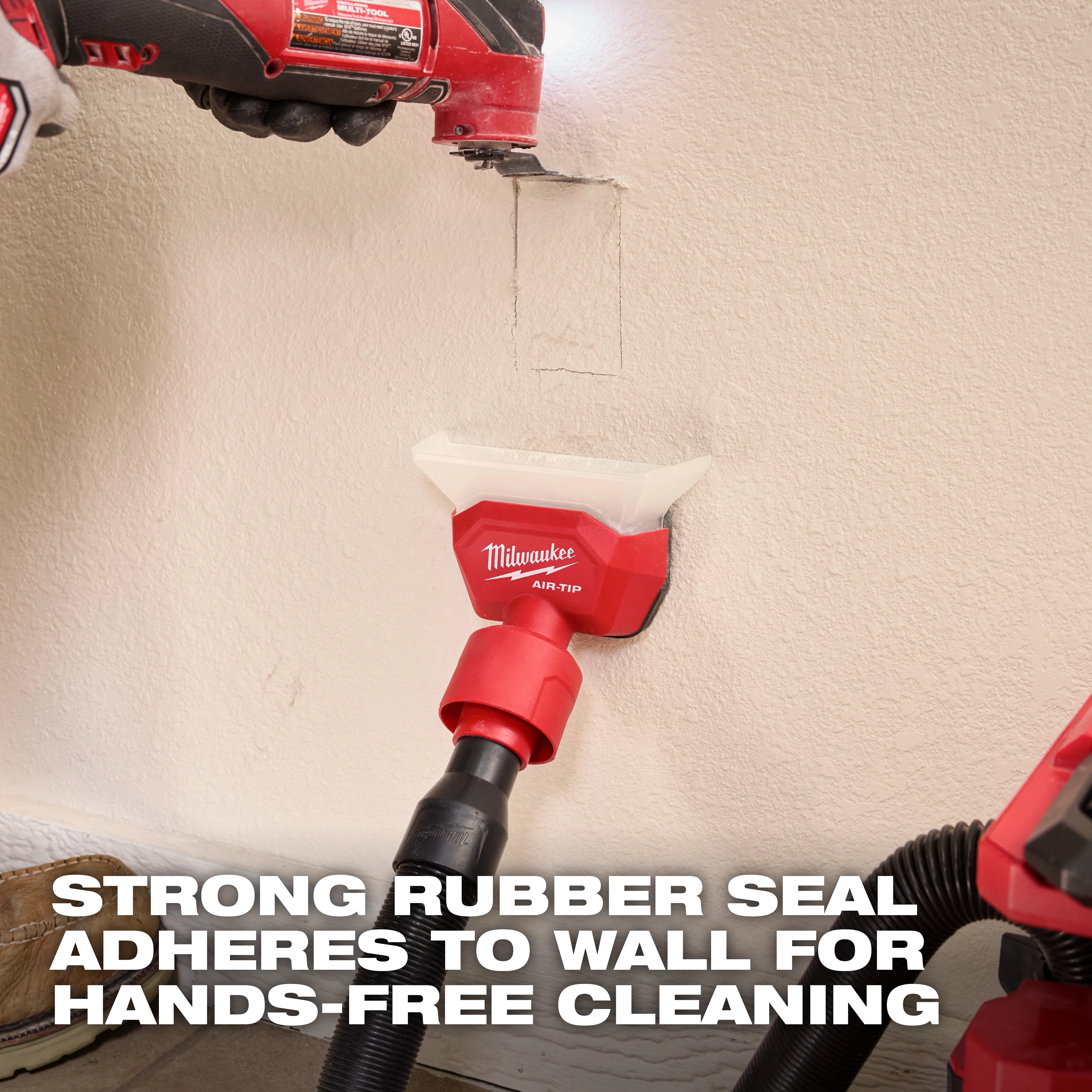 AIR-TIP Compact Dust Collector attached to a vacuum hose, adhering to a wall for hands-free cleaning with a rubber seal.