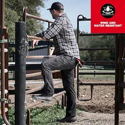 Image of a man wearing Milwaukee FREEFLEX™ Tech Pants on the jobsite