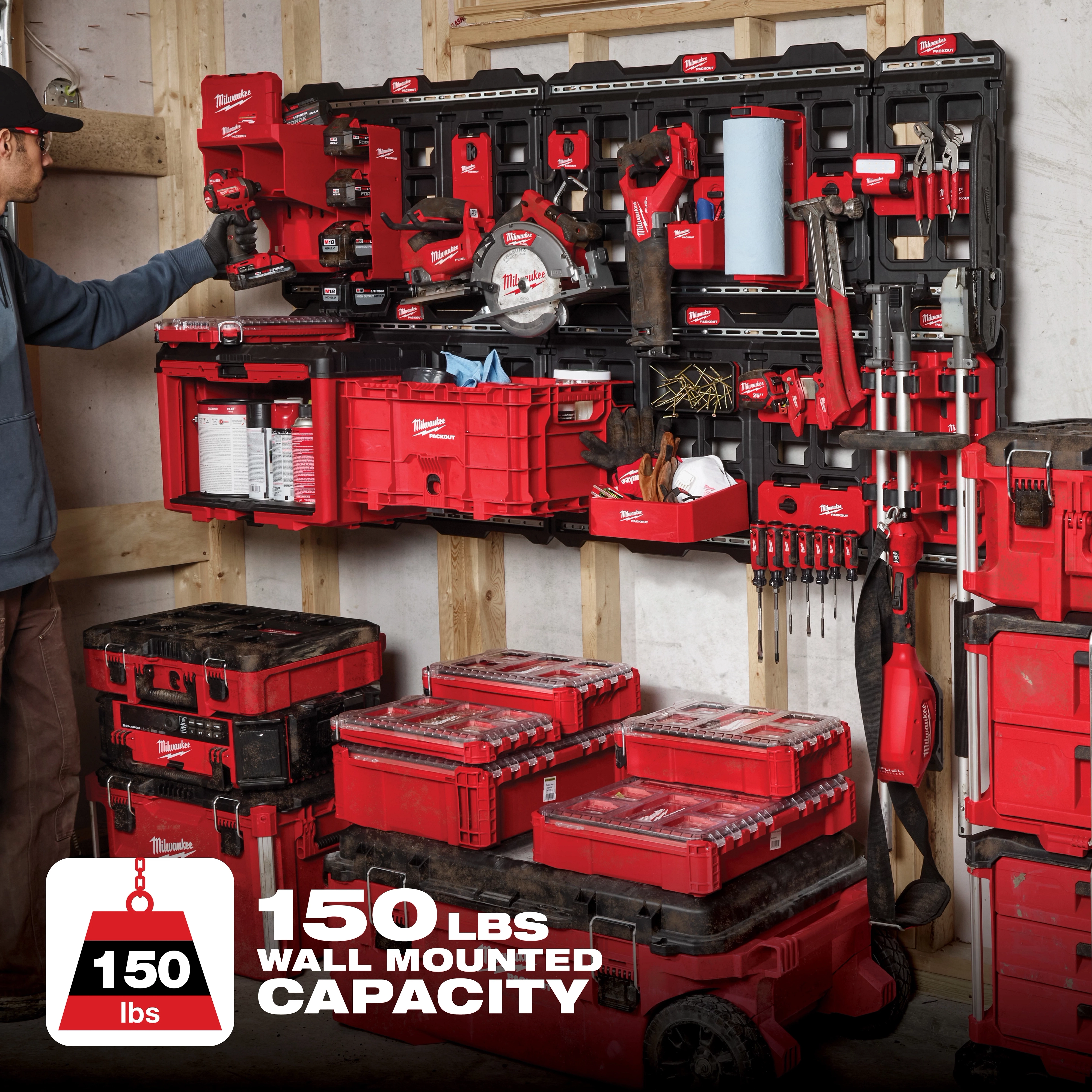 PACKOUT Large Wall Plate loaded with various red toolboxes, power tools, and accessories mounted on a wall, 150 lbs capacity.