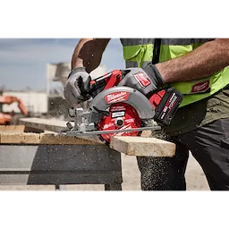 Worker cutting lumber with a circular saw using a 6-1/2” 24T NITRUS Carbide Framing & Demolition Circular Saw Blade.