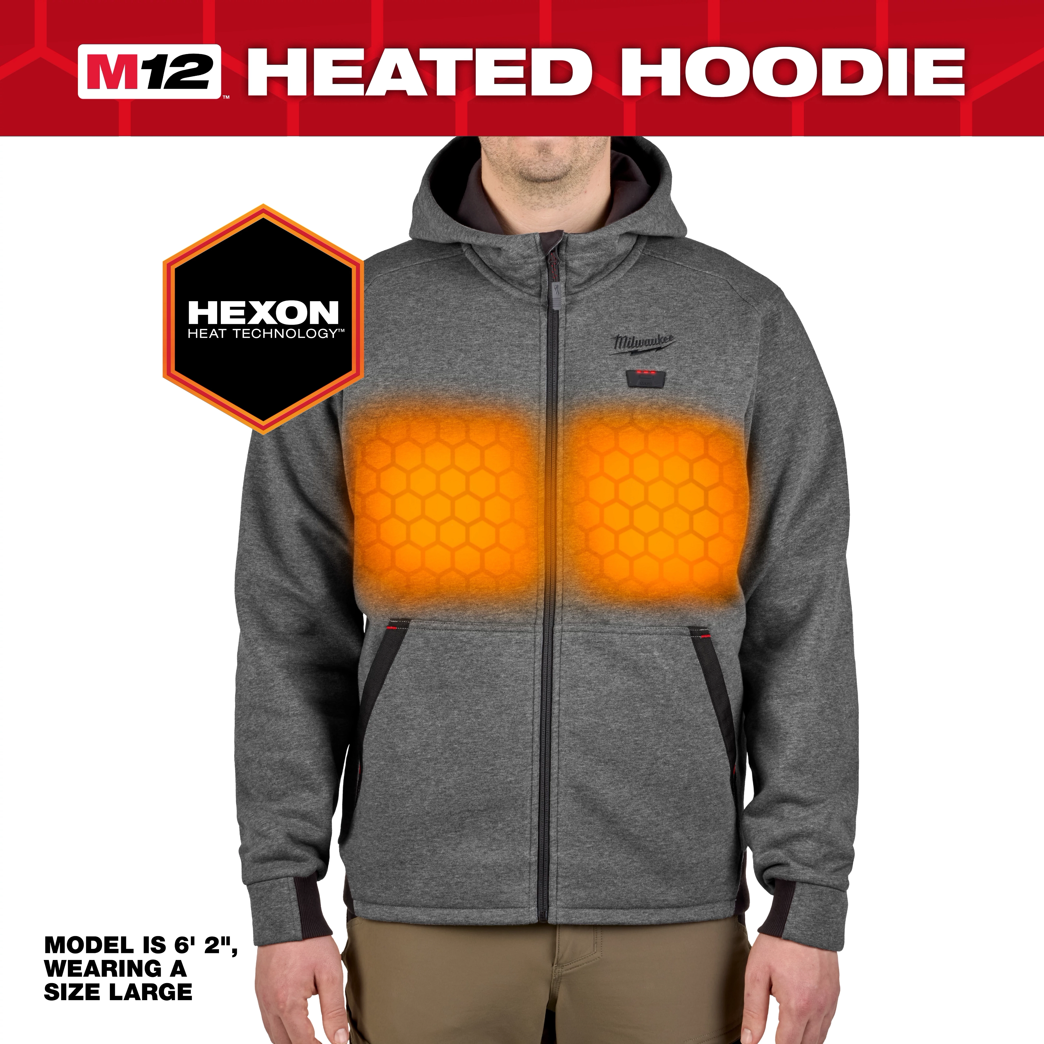 The M12™ Heated Hoodie features Hexon Heat Technology with visible heating elements on the chest area. It is gray, has a front zipper, and includes pockets. The model is 6'2", wearing a size large.