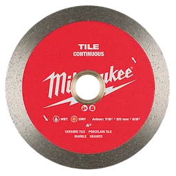 A red Milwaukee tile cutting blade labeled "continuous" with a metallic edge. Text on the blade indicates it can be used on ceramic tile, porcelain tile, marble, and granite. Symbols show it is suitable for both wet and dry cutting. The arbor specifications are 7/8", 20 mm, and 5/8".