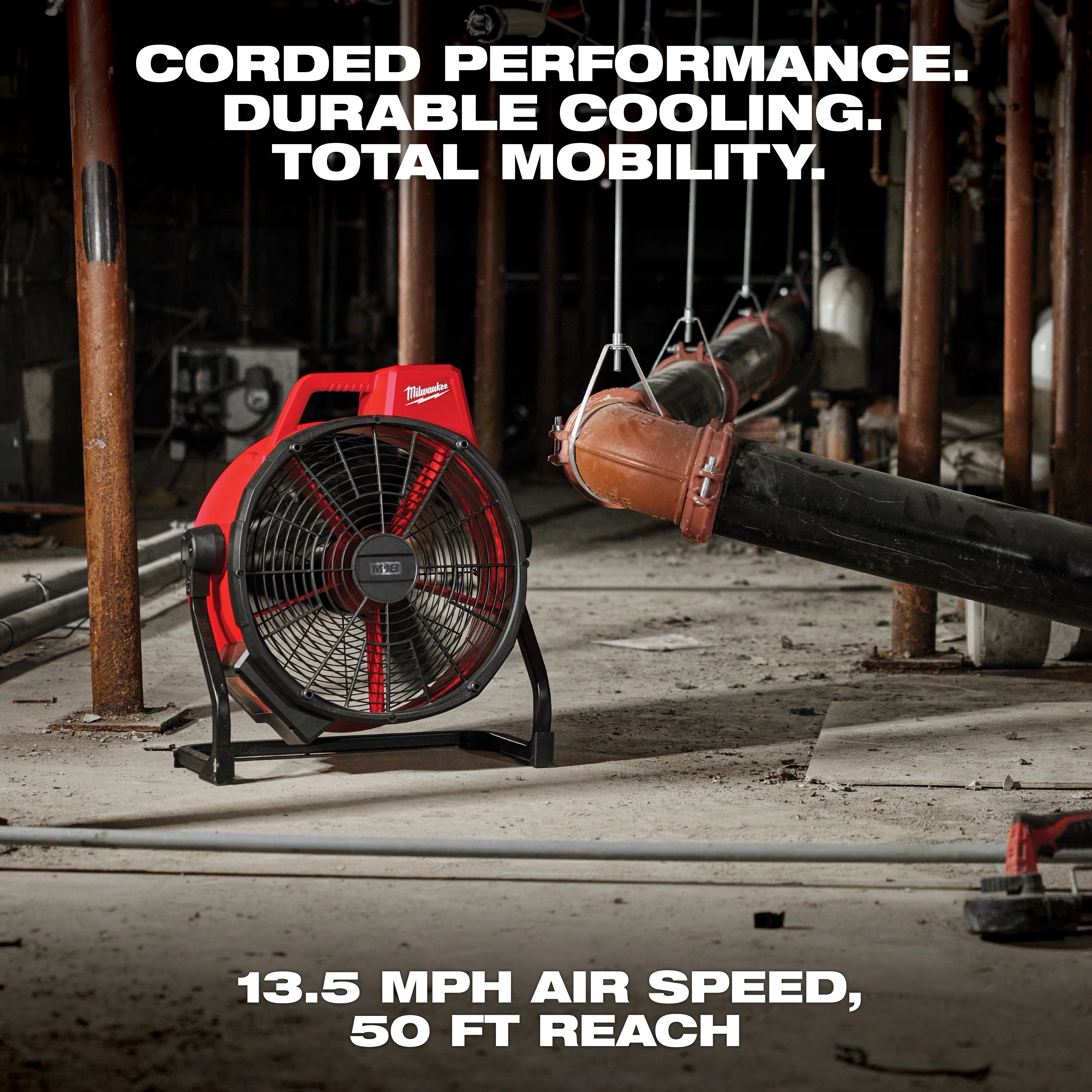 The image shows the M18 Brushless 18 in. Fan in a rugged industrial setting. Text emphasizes its features: "Corded Performance. Durable Cooling. Total Mobility." At the bottom, additional text states, "13.5 mph air speed, 50 ft reach." The fan has a red and black design.
