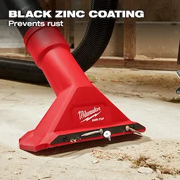 The image features the AIR-TIP™ 2 1/2" Magnetic Utility Nozzle by Milwaukee. It is red, attached to a black hose, and shown on a dusty floor picking up nails and screws. The text "BLACK ZINC COATING" and "Prevents rust" is displayed.