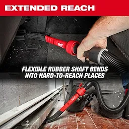 A person uses the AIR-TIP™ Flexible Long Reach Crevice Tool to clean hard-to-reach areas. The flexible rubber shaft bends easily, making it effective for various cleaning tasks. Text on the image reads, "EXTENDED REACH" and "FLEXIBLE RUBBER SHAFT BENDS INTO HARD-TO-REACH PLACES."