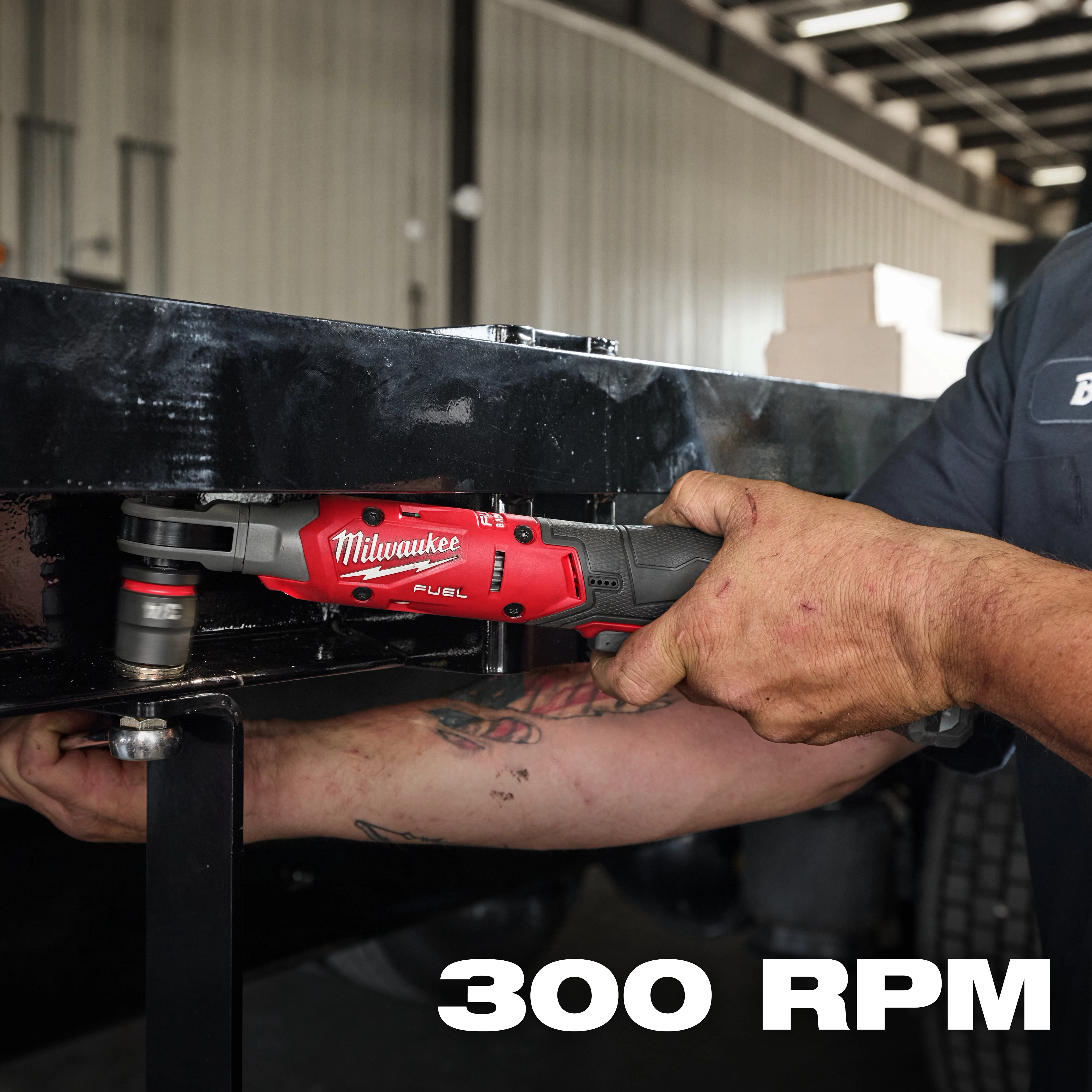 The M12 FUEL™ 1/2" Ratchet is being used to tighten a bolt on a black metal surface. The tool is red and black, and the text "300 RPM" appears in the bottom right corner of the image.
