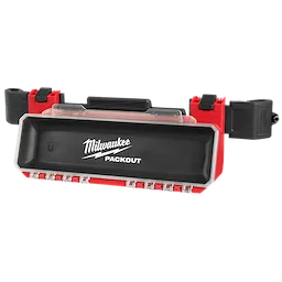 The PACKOUT Tool Box Magnetic Bin Attachment is a rectangular, black and red storage bin with a clear cover. It features the Milwaukee logo and has multiple clips for attachment. This magnetic bin is designed for easy organization and accessibility of small tools and hardware.