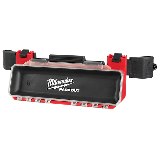 The PACKOUT Tool Box Magnetic Bin Attachment is a rectangular, black and red storage bin with a clear cover. It features the Milwaukee logo and has multiple clips for attachment. This magnetic bin is designed for easy organization and accessibility of small tools and hardware.