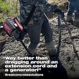 Worker using a cordless concrete vibrator on a construction site, with text overlay: "Way better than dragging around an extension cord and a generator!"