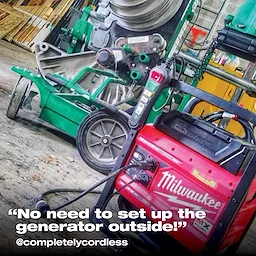 Close-up of red Milwaukee generator and green machine indoors with the text, "No need to set up the generator outside!"