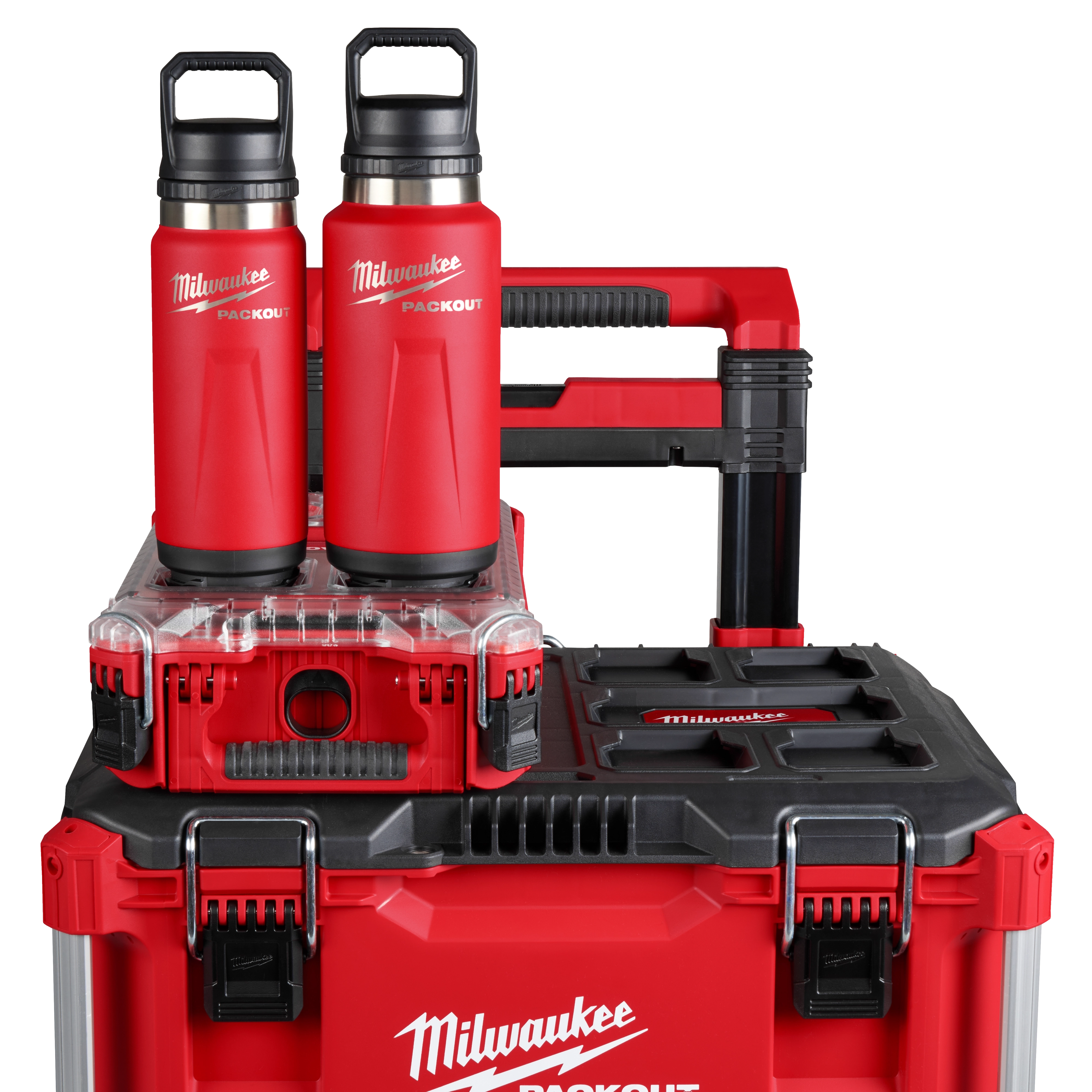 Two red PACKOUT 24oz Insulated Bottles with Chug Lids are placed on a stack of red tool storage boxes branded with "Milwaukee."