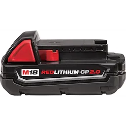 The M18 Redlithium 2.0 Compact Battery Pack features a predominantly black body with red accents. The product's label clearly displays "M18 REDLITHIUM CP2.0" in bold lettering. Designed for power tools, the battery pack contains ventilation slots and a secure locking mechanism on top.