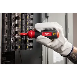 A 2-in-1 1000V Insulated Flip Shank Multi-Bit Screwdriver is being used on an electrical panel.