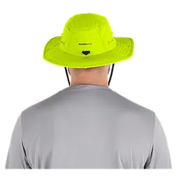 A person wearing a bright yellow WORKSKIN Sunshade Hat seen from the back. The hat features a wide brim and adjustable chin strap, designed for sun protection.