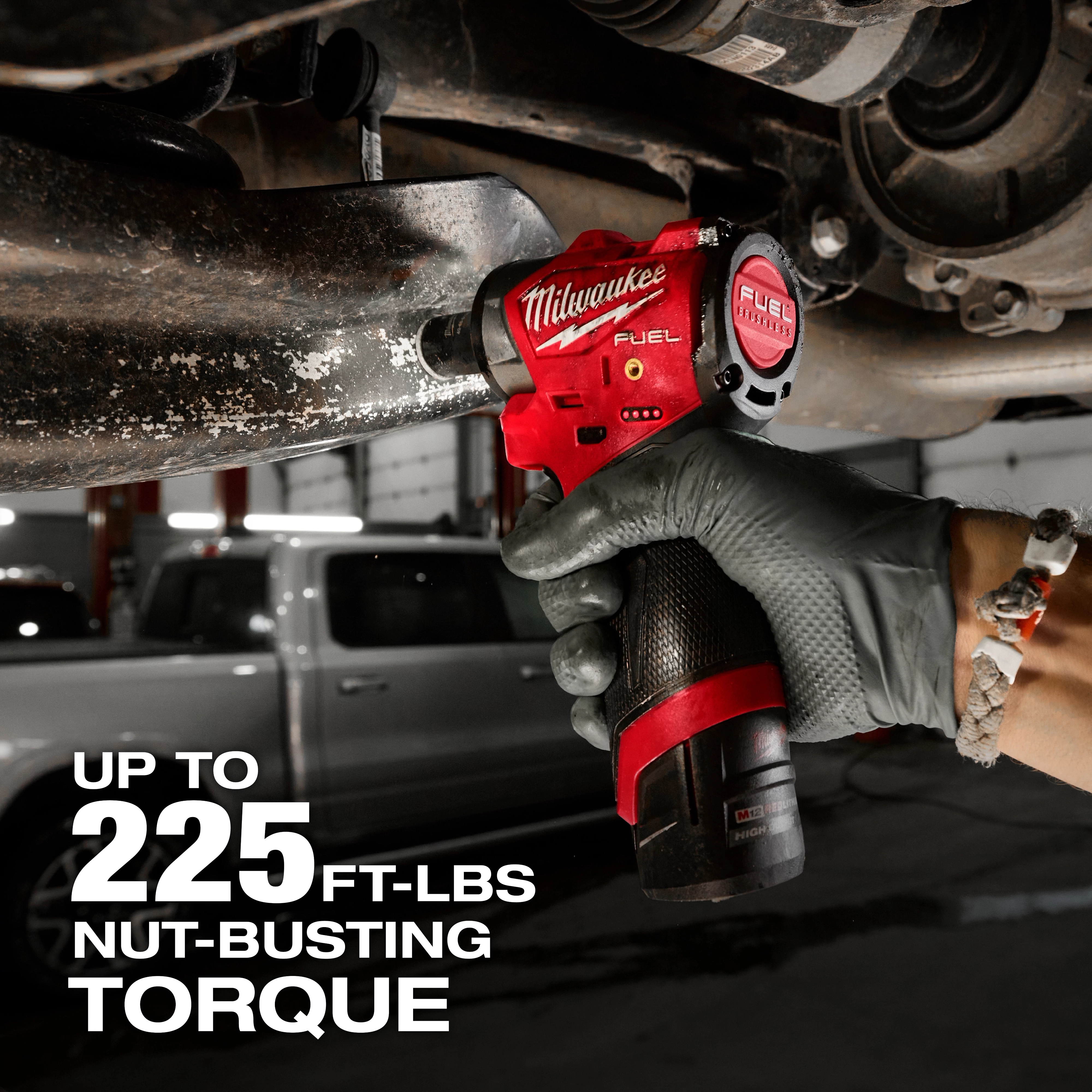A person uses the M12 FUEL™ 3/8" Subcompact Impact Wrench w/ Friction Ring to remove a bolt from a vehicle part. The text on the image indicates it has up to 225 ft-lbs of nut-busting torque.