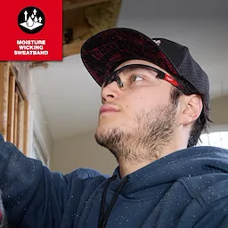Flat Brim Snapback hat with moisture-wicking sweatband, worn by a person in a blue hoodie, working in a construction setting.