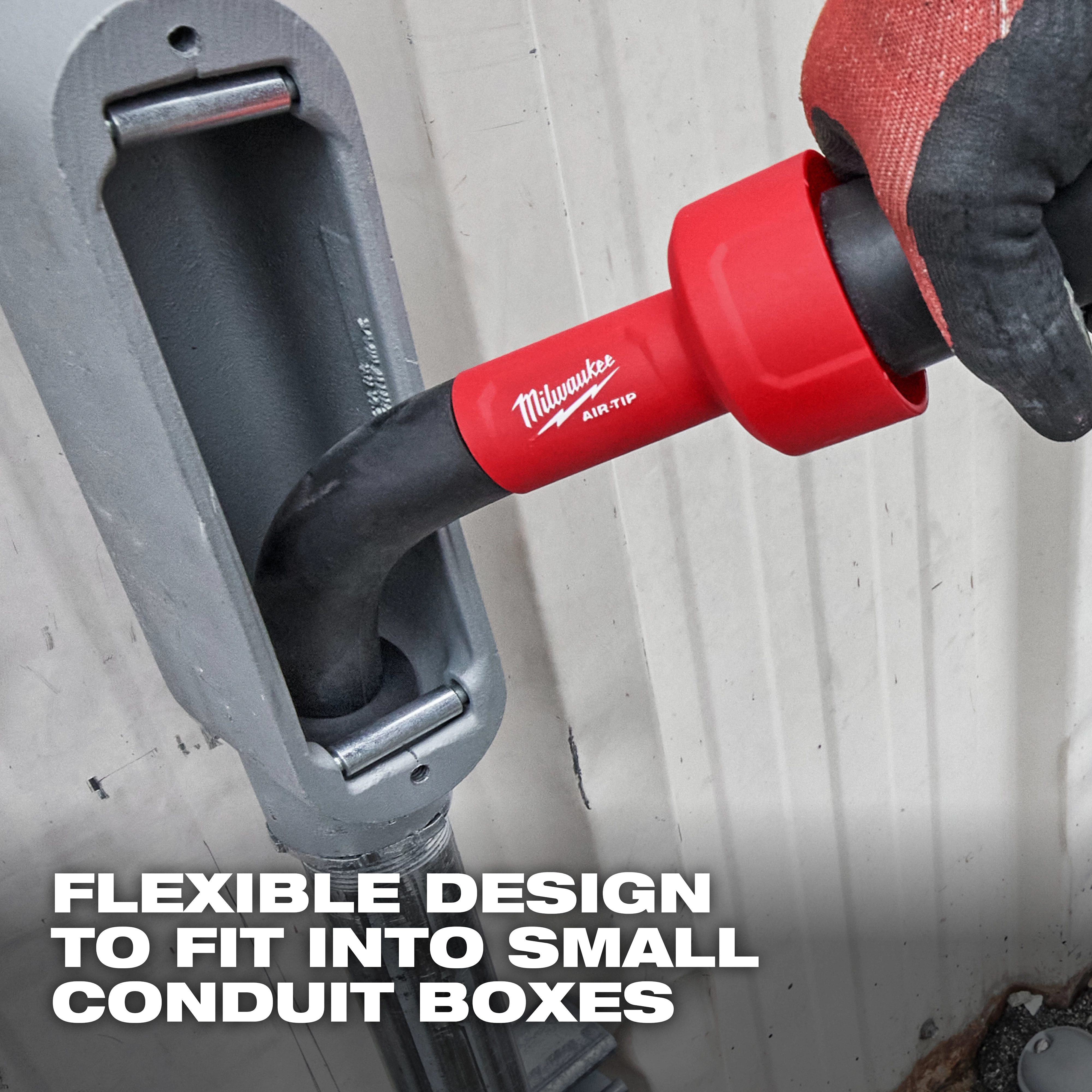 A close-up of the AIR-TIP™ Conduit Line Puller Kit being used to insert a cable through a small conduit box. A gloved hand is holding the tool with the text "Flexible Design to Fit Into Small Conduit Boxes" overlaid at the bottom.