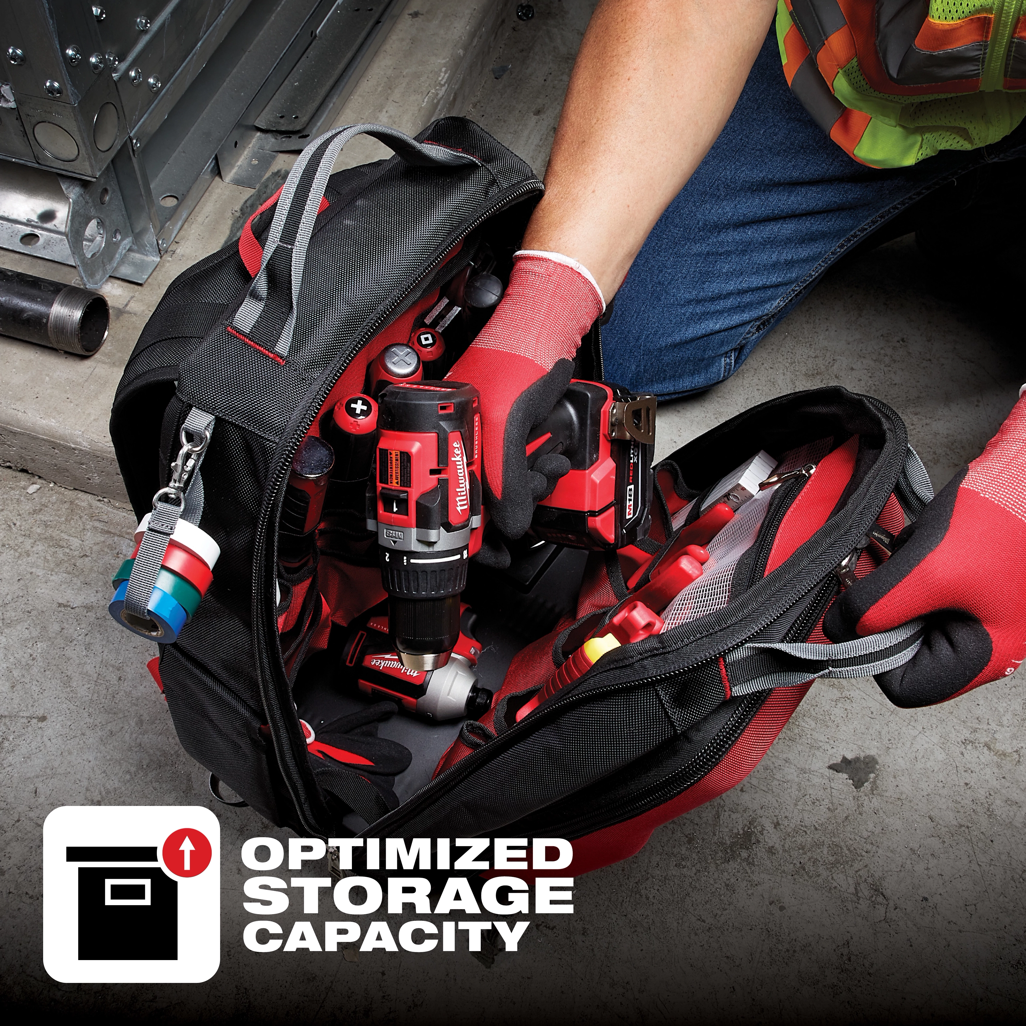 App%20Shot%20Overlay tool bag highlighting optimized storage capacity, shown with various red and black power tools and accessories.