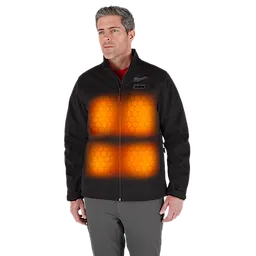 A person wearing the M12™ Heated TOUGHSHELL™ Jacket is shown, with highlighted heating zones on the chest area emitting an orange glow. The jacket is black with a zipper front, displaying the Milwaukee logo on the upper left side.