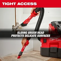 The image shows a person using the AIR-TIP™ 2-in-1 Utility Brush Tool to clean a tight corner near a cabinet hinge. The tool is attached to a vacuum hose and has a sliding brush head. The text reads, "TIGHT ACCESS" and "SLIDING BRUSH HEAD PROTECTS DELICATE SURFACES."