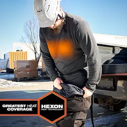 Worker wearing Milwaukee Heated Merino Wool Crew Neck Baselayer and Milwaukee Heated Merino Wool Baselayer Pants outdoors