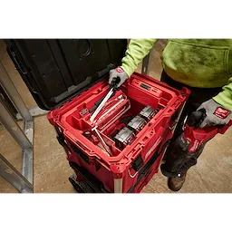 Tool Box Attachment Ready Tray for PACKOUT Tool Boxes with organized tools and accessories, held by a person in a workshop.