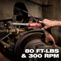 M12 FUEL 1/2" Extended Reach Ratchet tightening a bolt in a vehicle wheel assembly, text reads 80 FT-LBS & 300 RPM.