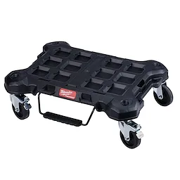 The PACKOUT Dolly is a black, heavy-duty rolling platform with a handle and four caster wheels, designed for transporting tools.