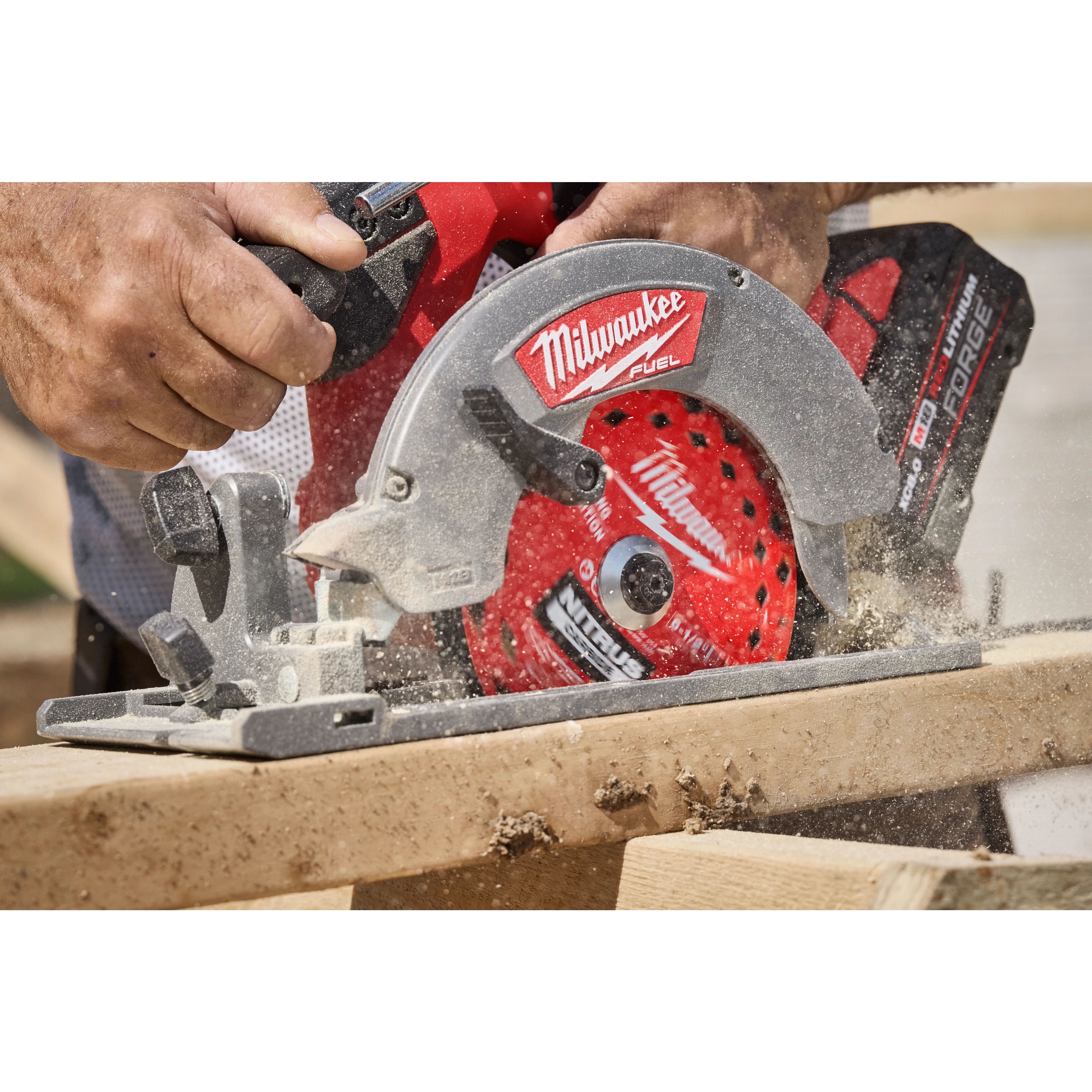 6-1/2” 24T NITRUS Carbide Framing & Demolition Circular Saw Blade cutting through a wooden board.