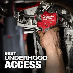 A person uses an M12 FUEL™ 3/8" Subcompact Impact Wrench w/ Friction Ring in a tight space under a car hood. The red and black tool provides optimal underhood access. White text at the bottom reads "Best Underhood Access."