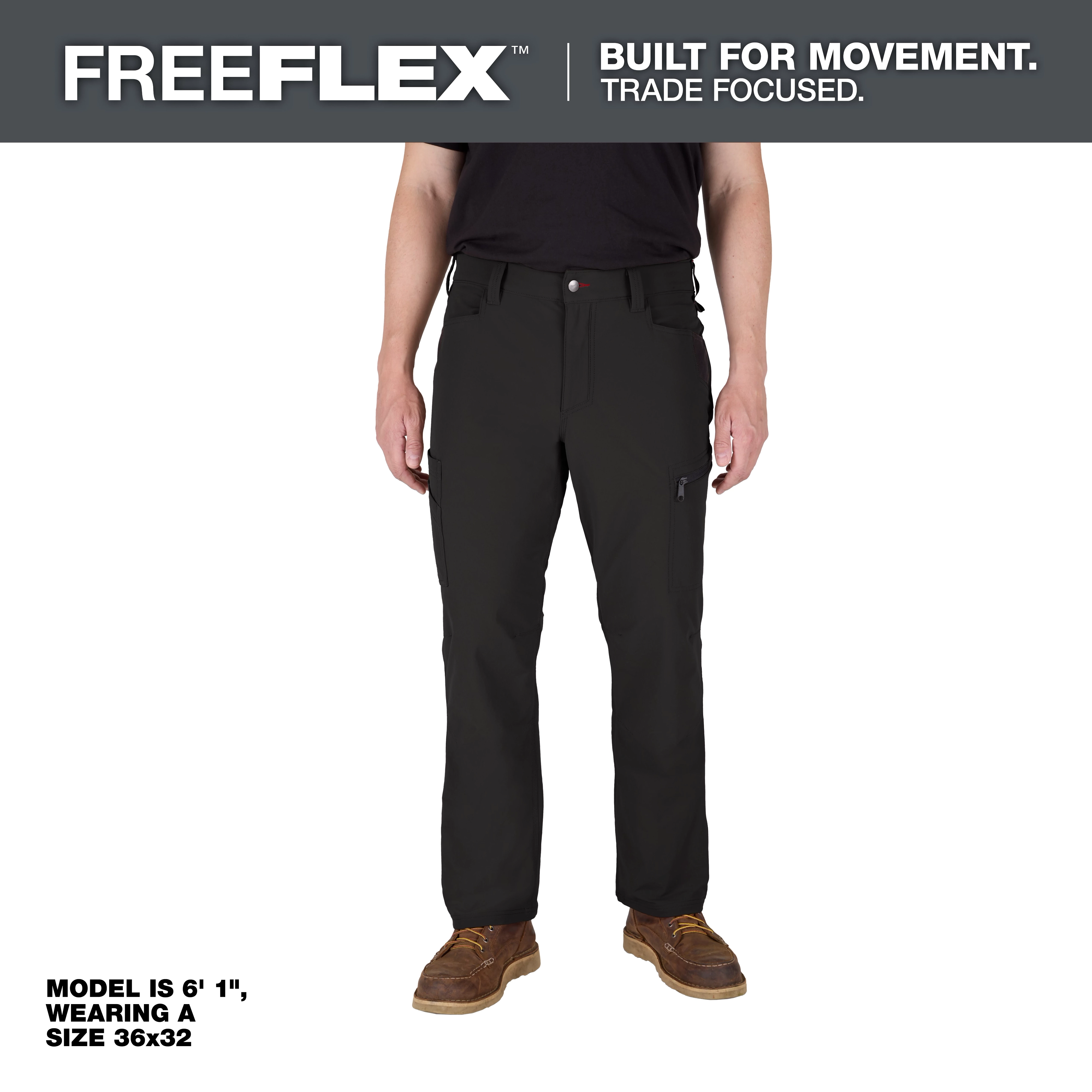 A man wearing FREEFLEX™ Tech Pants in black, paired with a black shirt and brown shoes. The text indicates the model is 6'1" and wearing size 36x32. The image promotes the movement and trade-focused design of the pants.