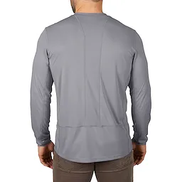 Man wearing a gray, long-sleeve WORKSKIN Lightweight Performance Shirt, viewed from the back, paired with brown pants.