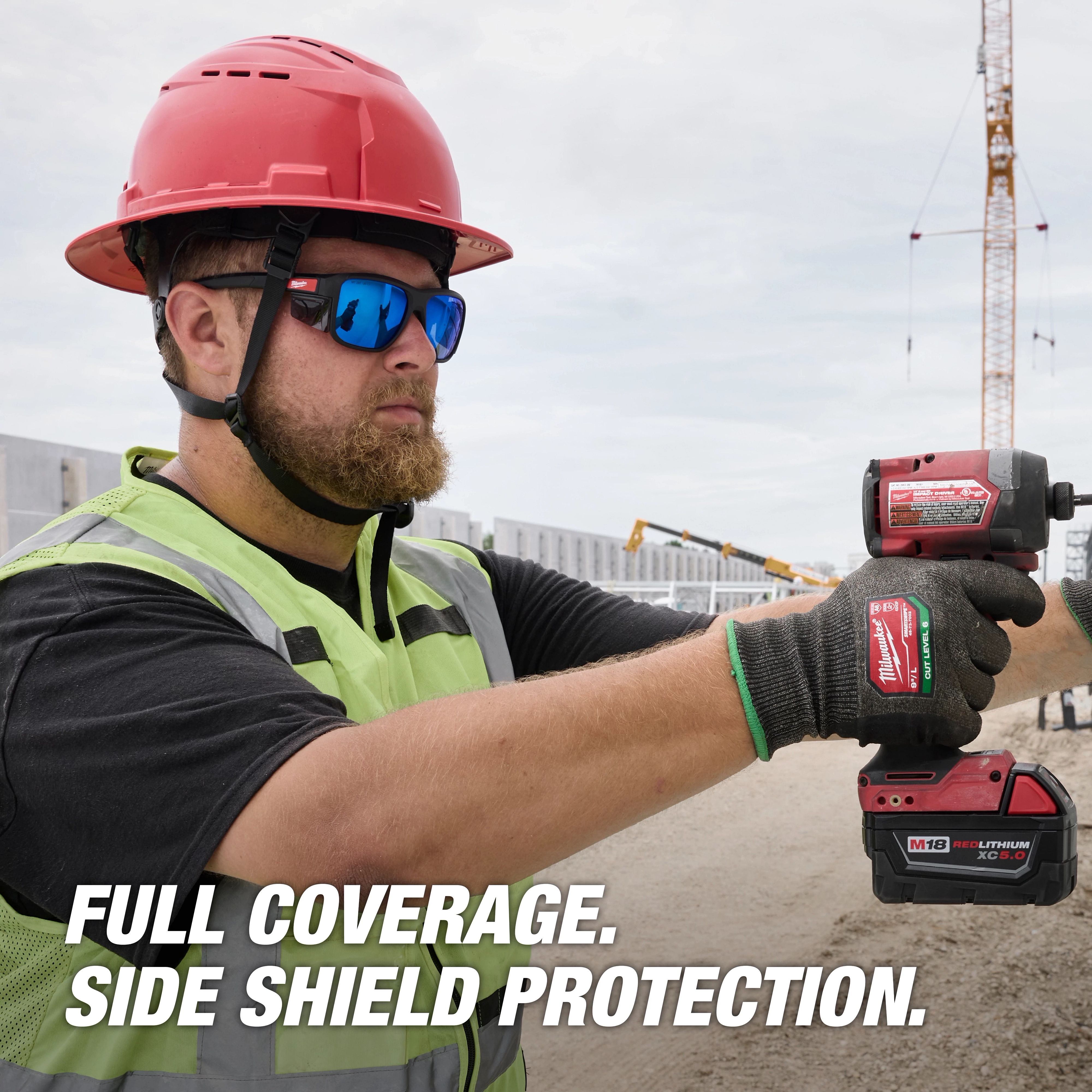 Worker wearing Full Frame Safety Glasses with Removable Side Shields – Blue Mirrored Anti-Scratch Lenses and a safety helmet.