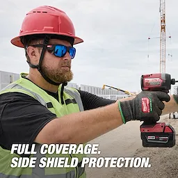 Worker wearing Full Frame Safety Glasses with Removable Side Shields – Blue Mirrored Anti-Scratch Lenses and a safety helmet.