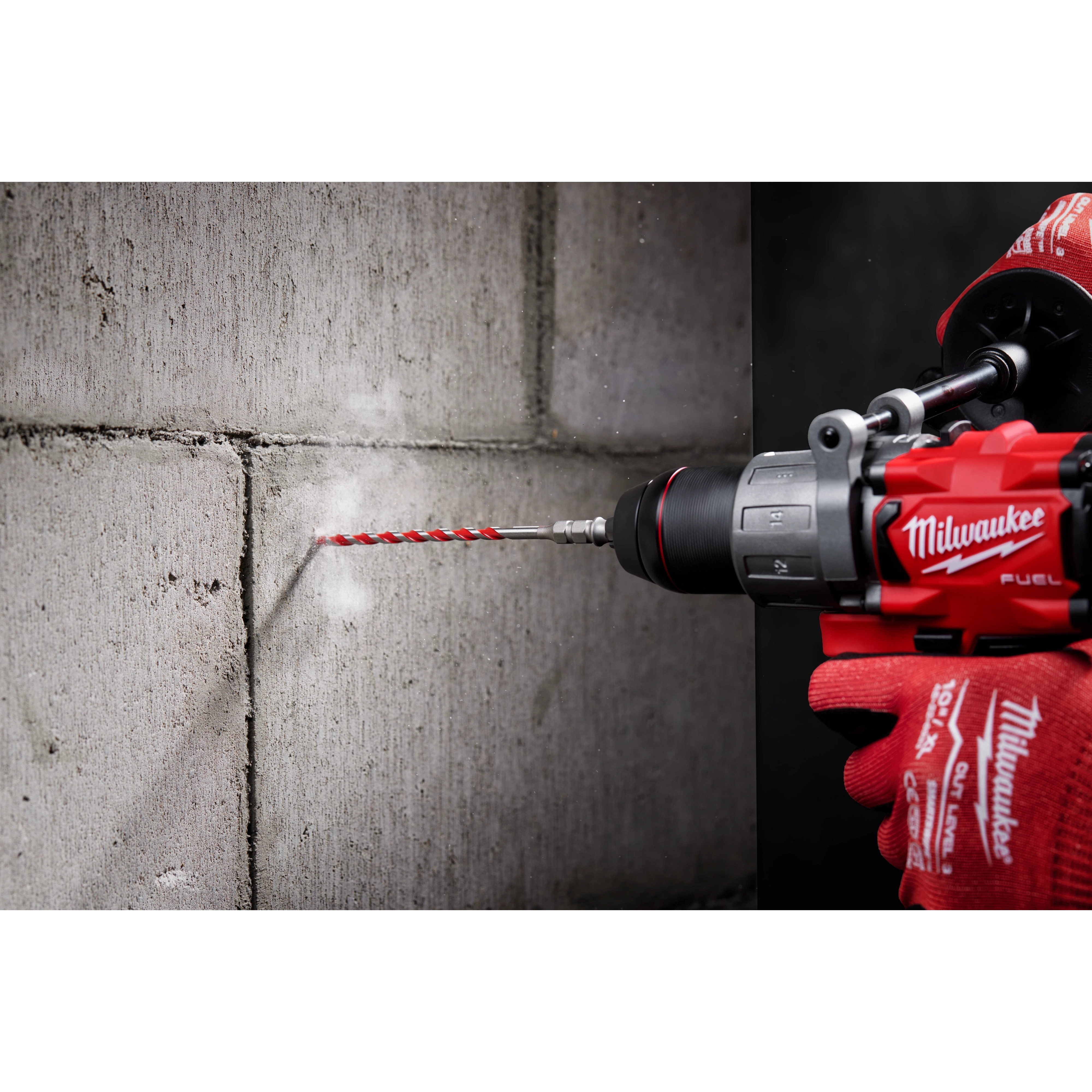 Worker using the Hammer Drill Bit Conrete Screw Installation tool