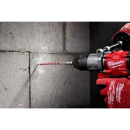 Worker using the Hammer Drill Bit Conrete Screw Installation tool