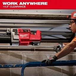 The image shows an M18 FUEL™ RINGER™ Roll Groover by Milwaukee being used on a pipe with under 4.5 inches of clearance.