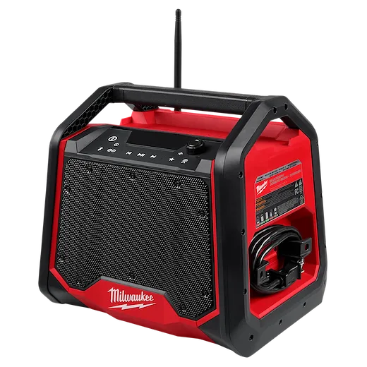 The Milwaukee M18™ Bluetooth® Jobsite Radio + Charger features a sturdy red and black design with a large speaker grille, control buttons on top, and a side compartment for cable storage. The device offers Bluetooth connectivity and charging capabilities for other devices, making it ideal for job sites.