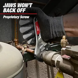 Gloved hand using 6" Adjustable Wrench on piping.