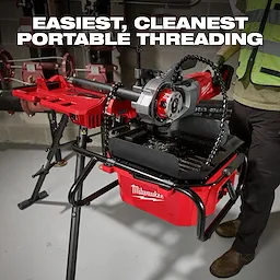 M18 Brushless Pipe Threading Oiler on a stand with a mounted threading tool in an industrial setting.