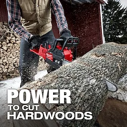 A person wearing gloves and a vest operates the M18 FUEL Chainsaw to cut a large log outdoors. Wood is stacked in the background. The text "POWER TO CUT HARDWOODS" is prominent in the foreground.