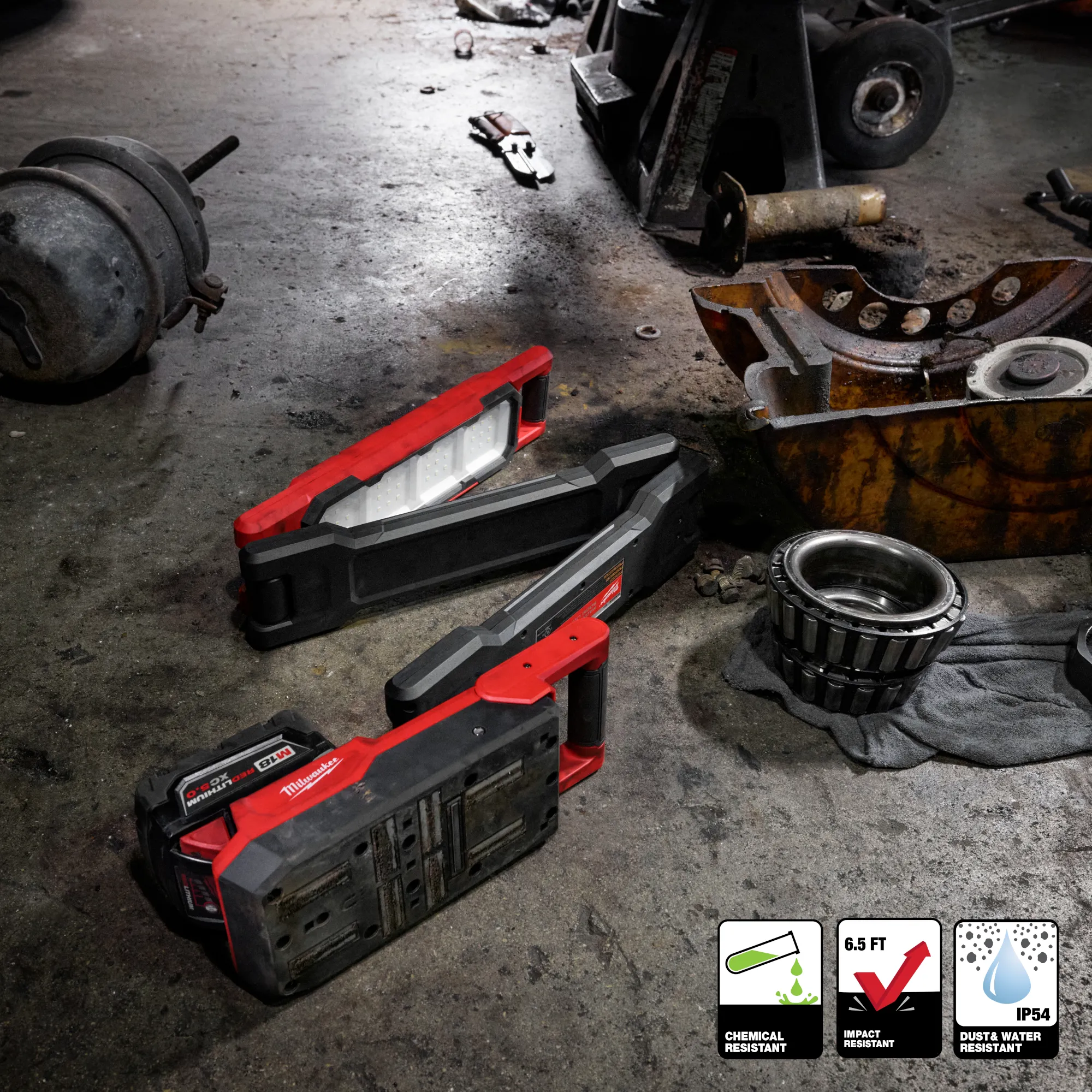 Image of the Milwaukee M18 Magnetic Extendable Boom Light on a jobsite floor highlighting its chemical, water, and impact-resistant features