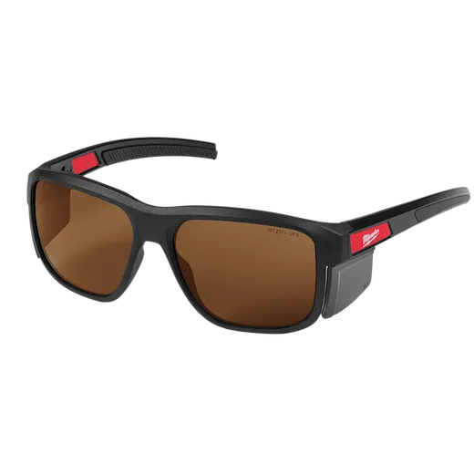 Full Frame Safety Glasses with Removable Side Shields feature brown anti-scratch lenses. The glasses have a black frame with red detailing on the arms and come with side shields for added protection. Ideal for use in construction or industrial settings requiring eye safety and durability.